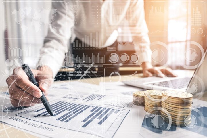 Big Data Technology for Business Finance Analytic Concept. Modern graphic interface shows massive information of business sale report, profit chart and stock market trends analysis on screen monitor.