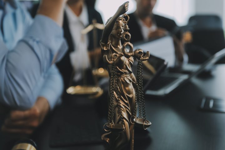 Group of experienced attorneys and lawyers giving consultation to client, helping with difficult lawsuit, explaining legal procedures and discussing agreement terms. Law services and support concept